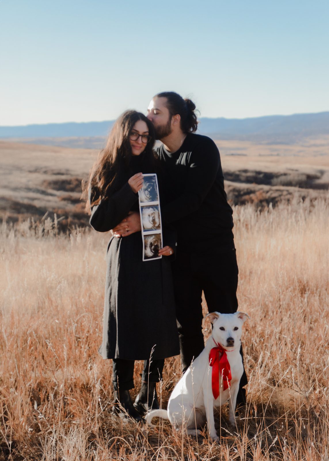 Couple with dog and sonogram