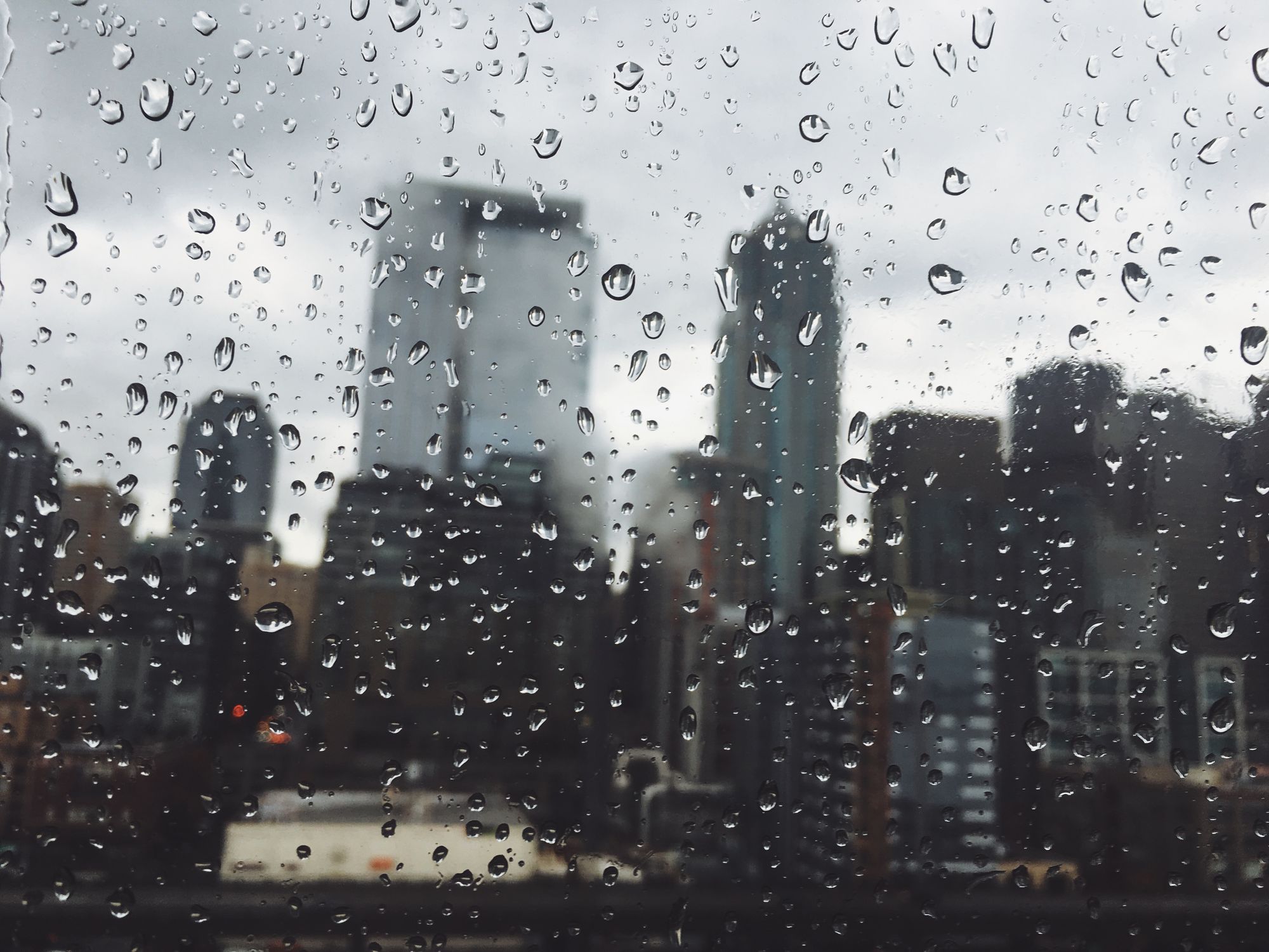 City skyline through a rainy window