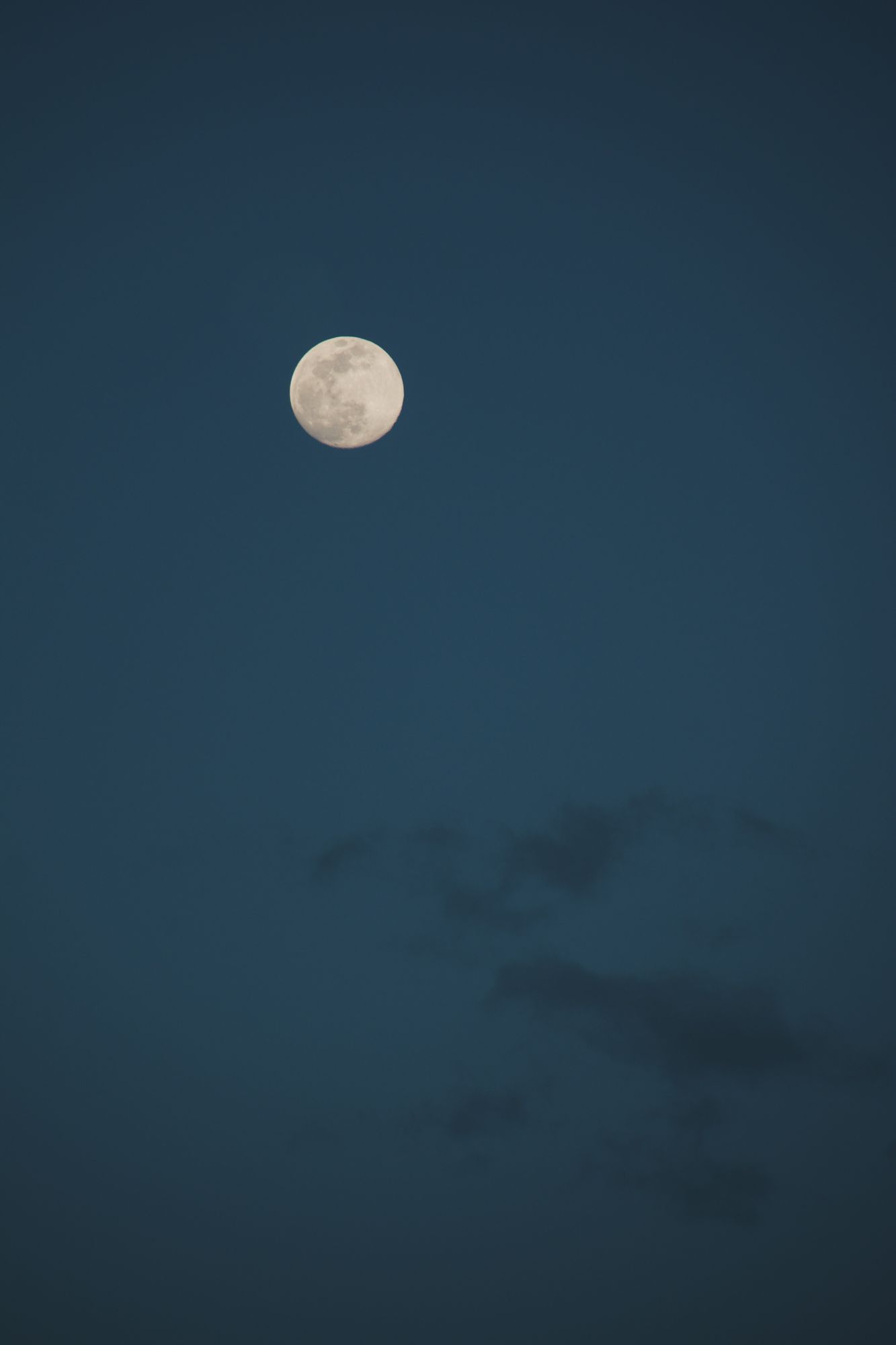 Full moon in a deep blue sky
