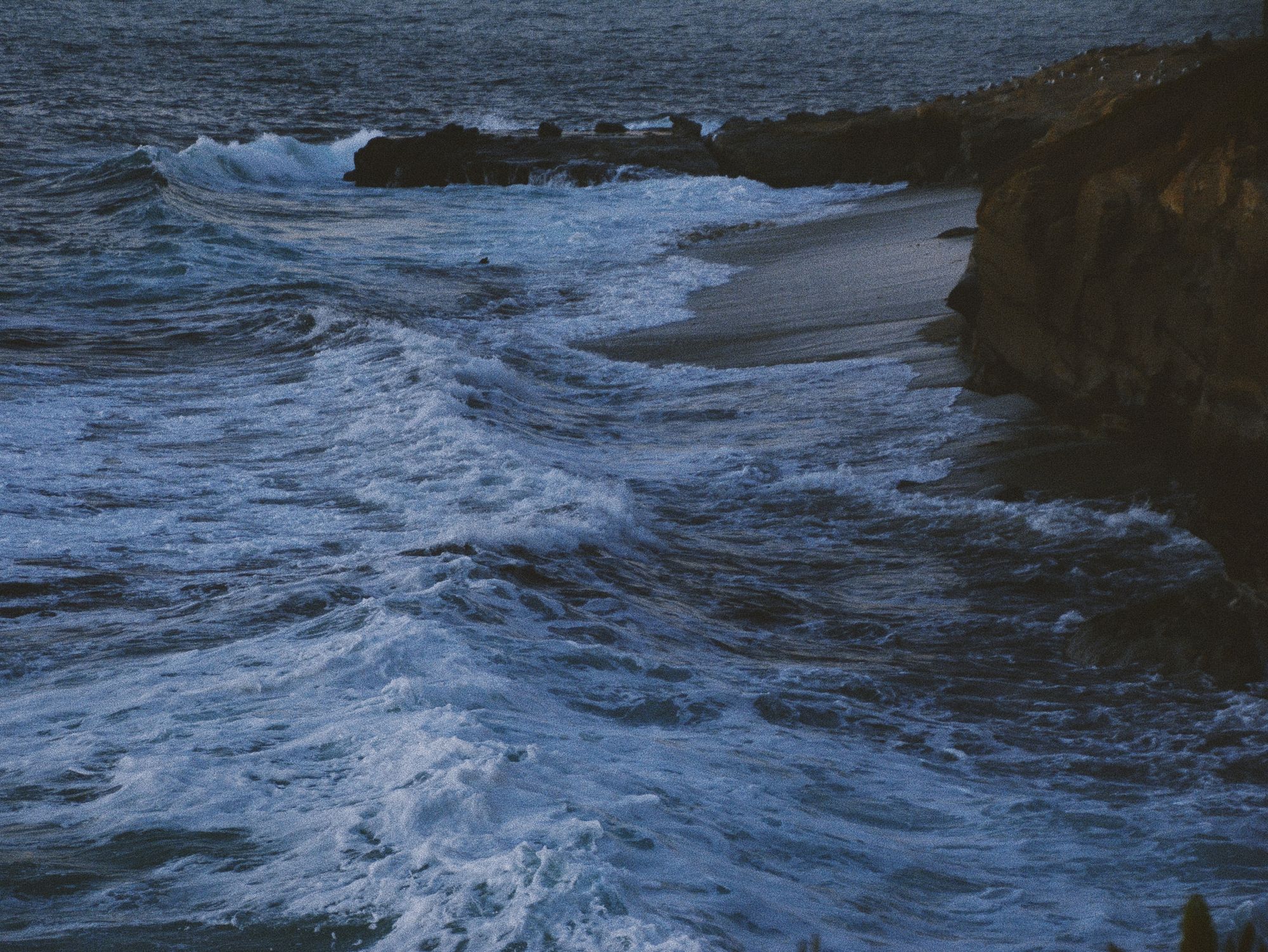Moody blue-hour surf